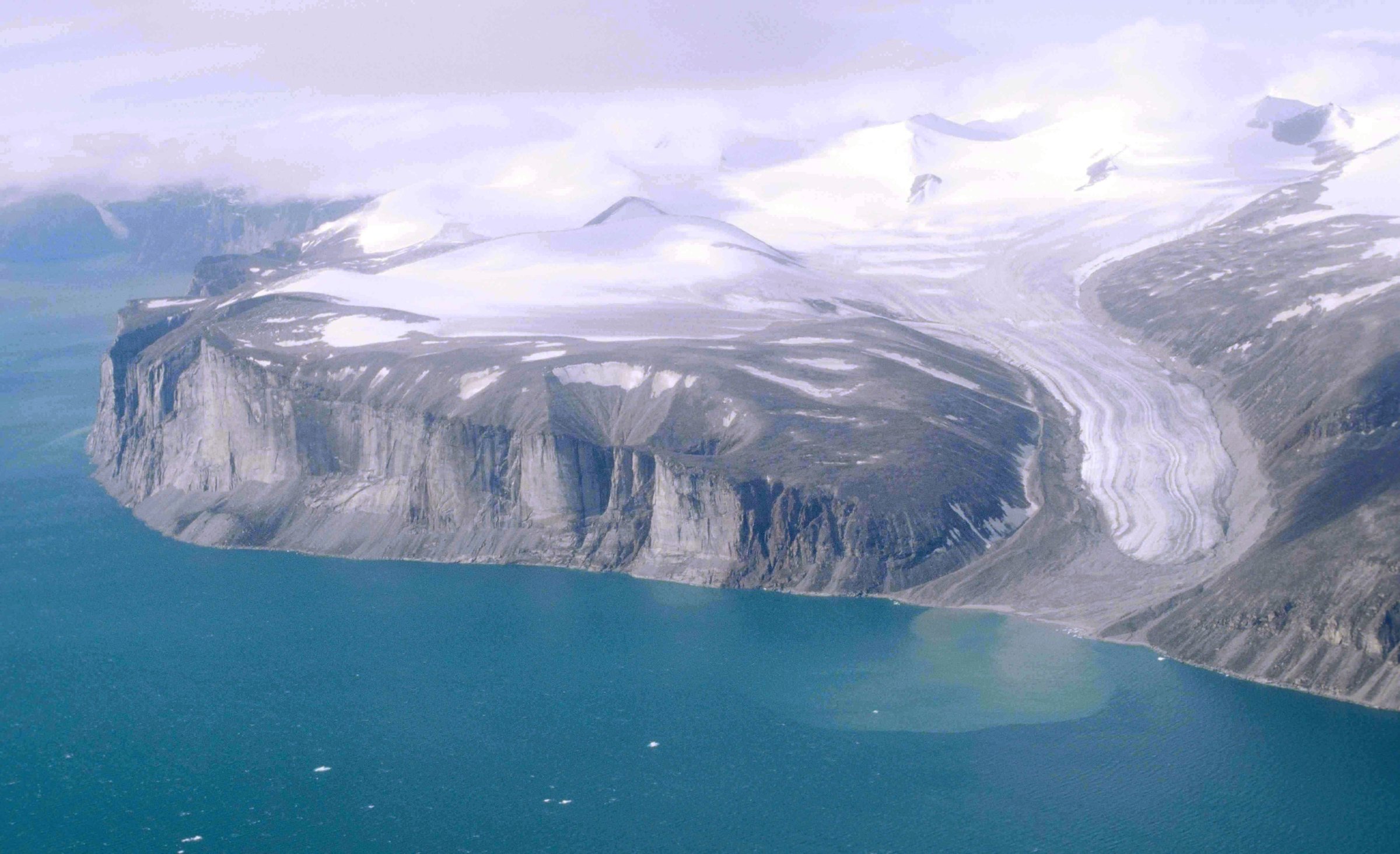 Aerial view of glacier-carved cliffs and fjord on Baffin Island, Nunavut